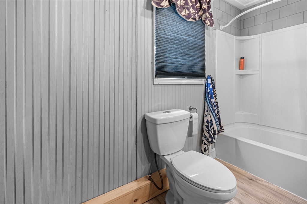 15 Morrison Way Lakeville, MA 02347 - Photo 25 of 26 a white toilet sitting next to a bath tub