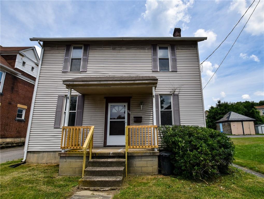 324 East Brady Street Butler, PA 16001 - Photo 1 of 11 a front view of a house with a yard