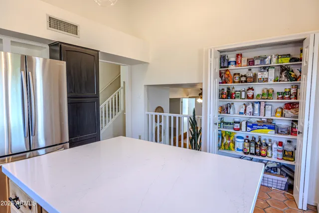 a bedroom with a bed and a book shelf