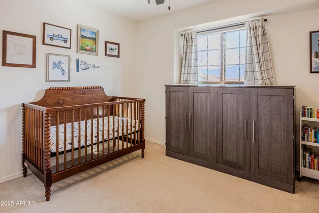 a bedroom with a bed and window