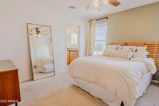 a large white bed in a white room