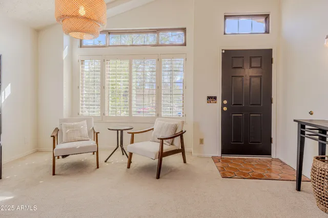 a bedroom with furniture and a window