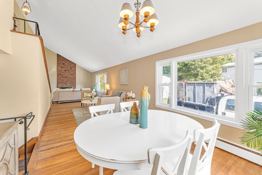 44 Milton Avenue Boston, MA 02136 - Photo 12 of 32 a view of a dining room with furniture a chandelier and wooden floor