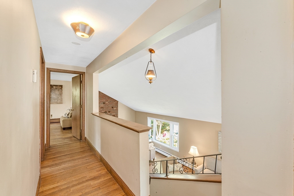 44 Milton Avenue Boston, MA 02136 - Photo 16 of 32 a view of a hallway with wooden floor and staircase