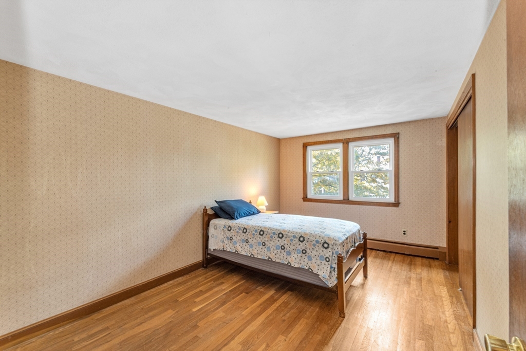 44 Milton Avenue Boston, MA 02136 - Photo 19 of 32 a room with a bed and a window