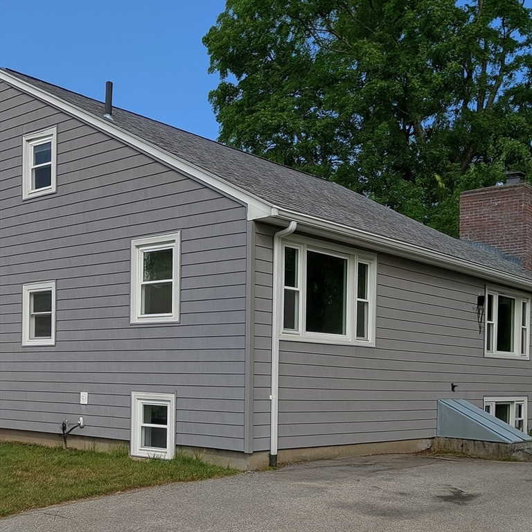 44 Milton Avenue Boston, MA 02136 - Photo 3 of 32 a front view of a house with a yard