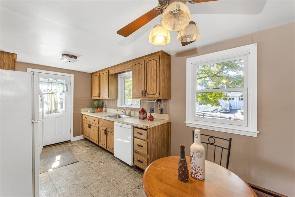 44 Milton Avenue Boston, MA 02136 - Photo 6 of 32 a kitchen with a stove a sink and a refrigerator