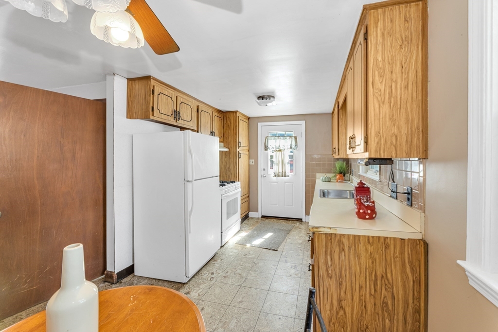44 Milton Avenue Boston, MA 02136 - Photo 7 of 32 a kitchen with stainless steel appliances a refrigerator and a window