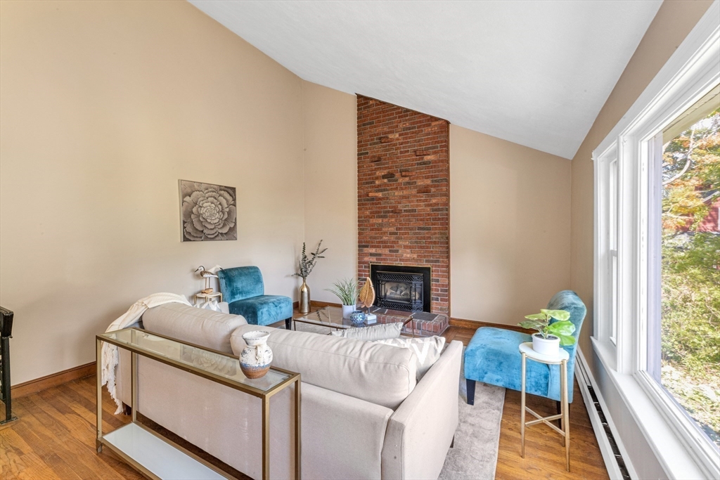 44 Milton Avenue Boston, MA 02136 - Photo 8 of 32 a living room with furniture and a fireplace