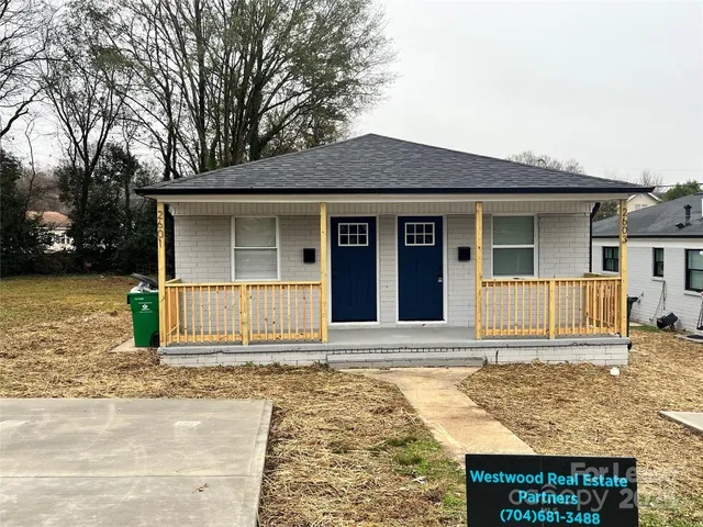 a house with trees in the background