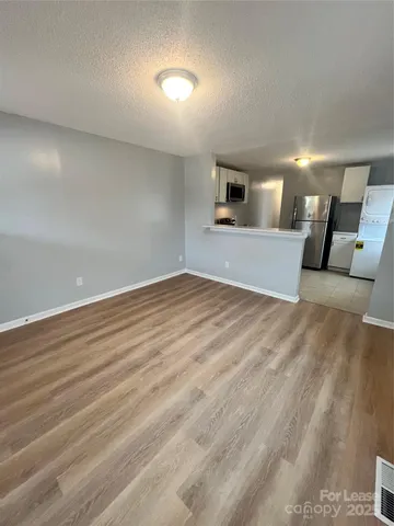 a view of a livingroom with wooden floor