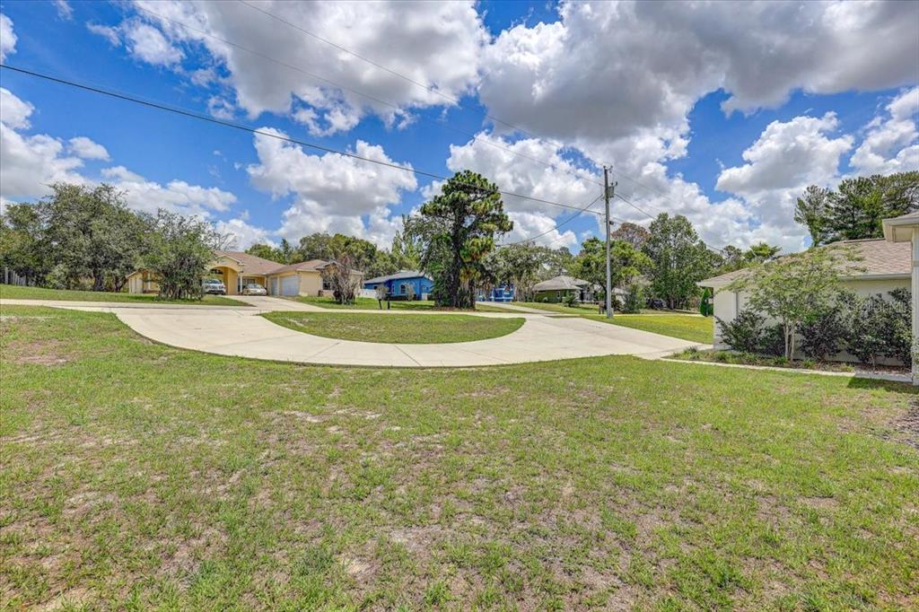 7314 Madrid Road Weeki Wachee, FL 34613 - Photo 2 of 54 a view of a playground with basketball court