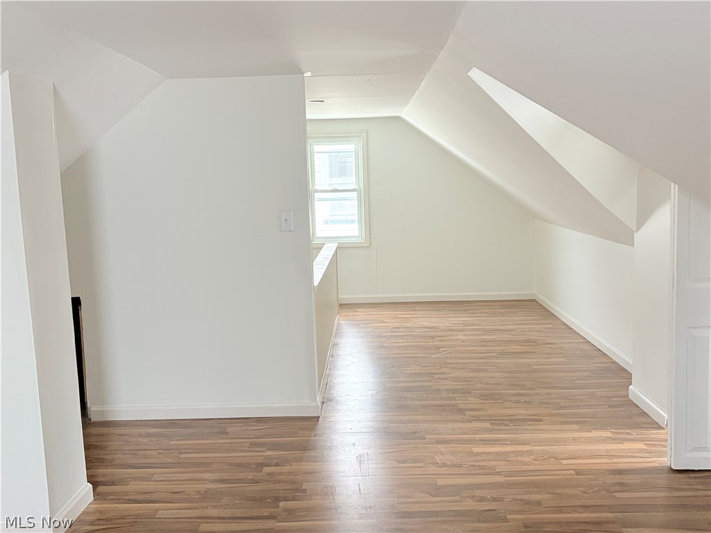 15521 Corkhill Road Maple Heights, OH 44137 - Photo 17 of 33 Bonus room with lofted ceiling and light wood-style flooring