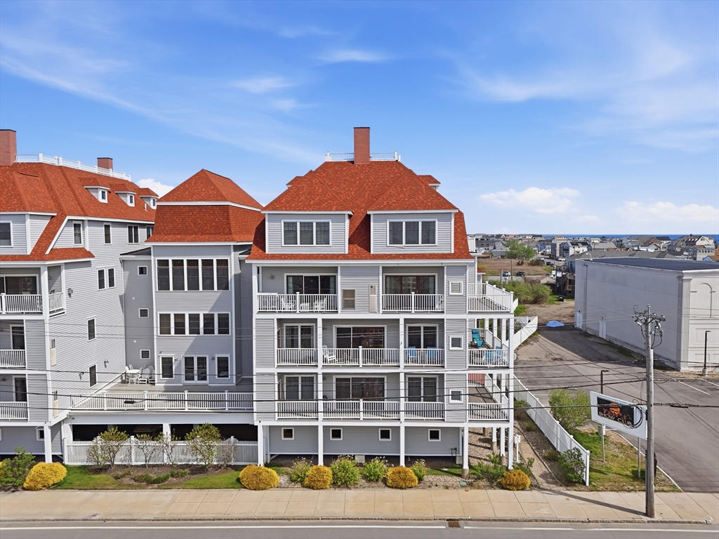 233 Beach Road, Unit A11 Salisbury, MA 01952 - Photo 1 of 37 a front view of a building with street view
