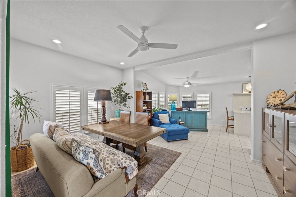 23301 Ridge Rte Drive, Unit 246 Laguna Hills, CA 92653 - Photo 15 of 35 a living room with furniture and a large window