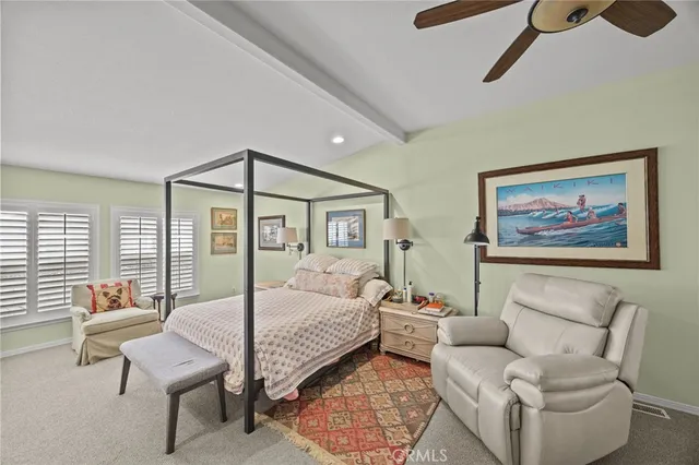 a bedroom with furniture and a window