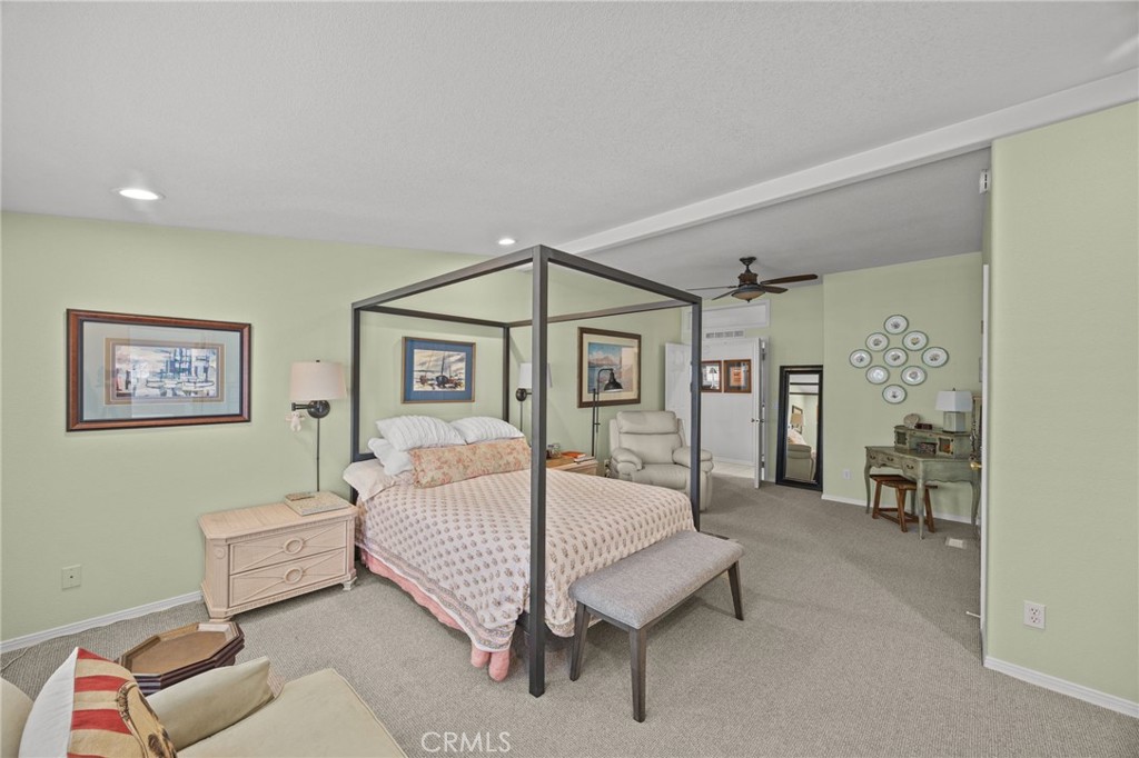 23301 Ridge Rte Drive, Unit 246 Laguna Hills, CA 92653 - Photo 17 of 35 a bedroom with a bed and a table