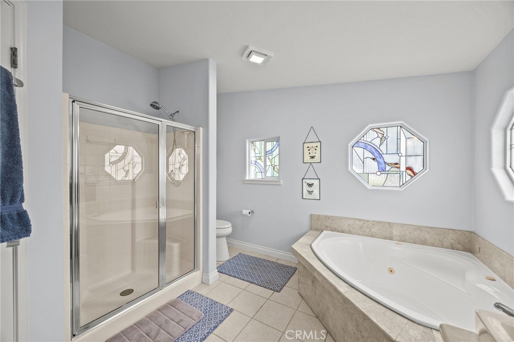 23301 Ridge Rte Drive, Unit 246 Laguna Hills, CA 92653 - Photo 20 of 35 a bathroom with a bathtub and a shower