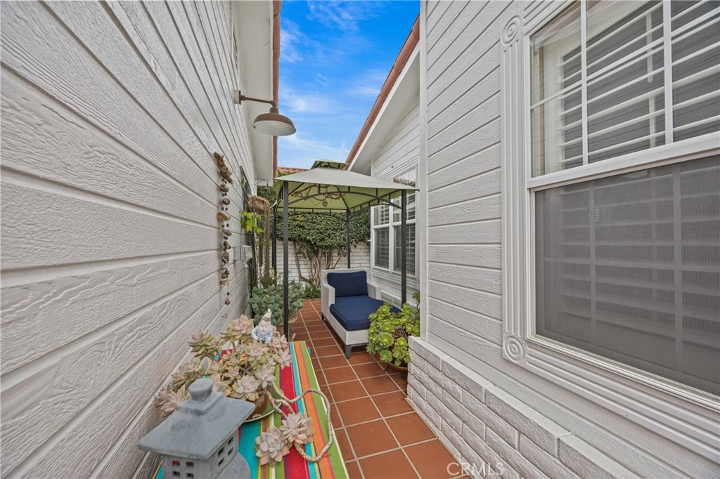 23301 Ridge Rte Drive, Unit 246 Laguna Hills, CA 92653 - Photo 24 of 35 a chair and table in a balcony