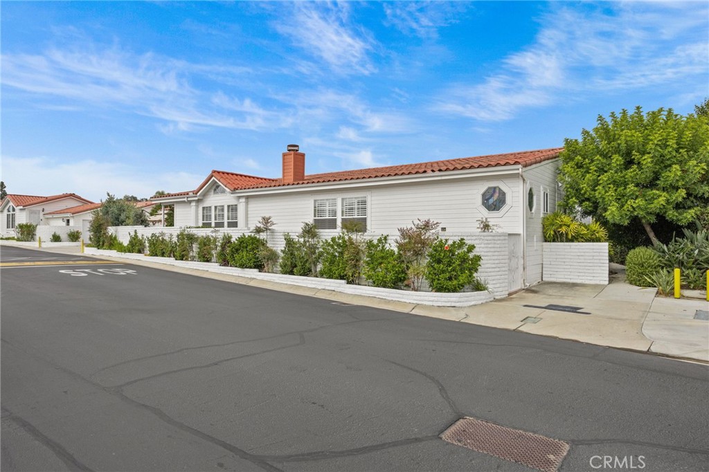 23301 Ridge Rte Drive, Unit 246 Laguna Hills, CA 92653 - Photo 26 of 35 a view of a house with a street
