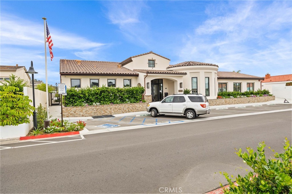 23301 Ridge Rte Drive, Unit 246 Laguna Hills, CA 92653 - Photo 27 of 35 a car parked in front of a building