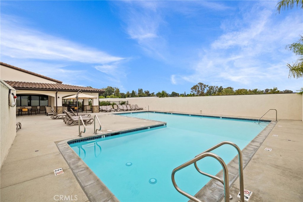 23301 Ridge Rte Drive, Unit 246 Laguna Hills, CA 92653 - Photo 34 of 35 a view of swimming pool with seating area and barbeque oven