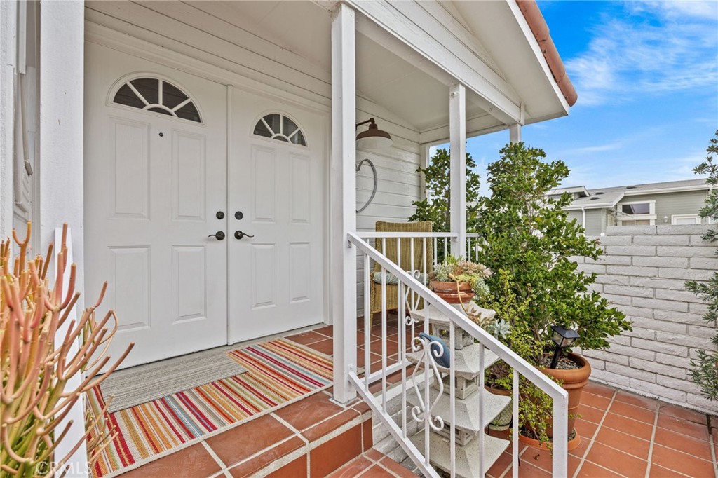 23301 Ridge Rte Drive, Unit 246 Laguna Hills, CA 92653 - Photo 5 of 35 a view of a balcony with wooden floor and staircase