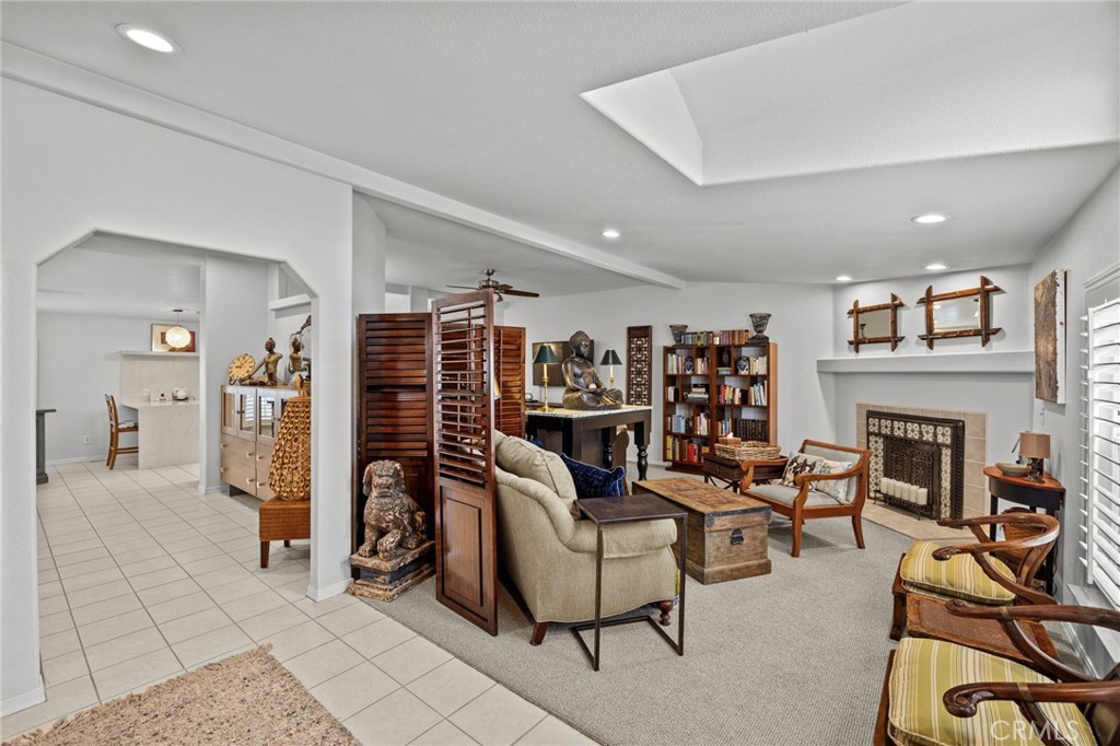 23301 Ridge Rte Drive, Unit 246 Laguna Hills, CA 92653 - Photo 6 of 35 a view of a livingroom with furniture and a fireplace
