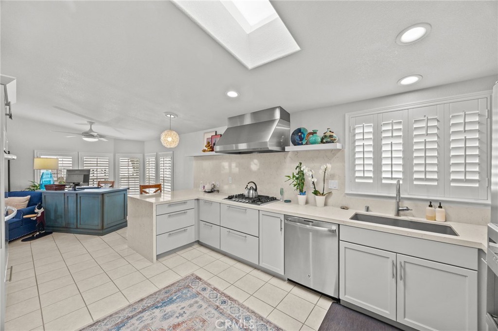 23301 Ridge Rte Drive, Unit 246 Laguna Hills, CA 92653 - Photo 10 of 35 a kitchen with a sink and cabinets