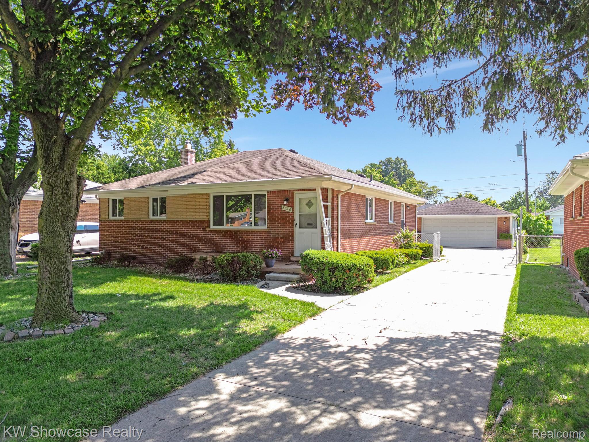 8936 Merriman Road Livonia, MI 48150 - Photo 1 of 49 Brick ranch-style exterior with a contrasting lighter colored upper facade