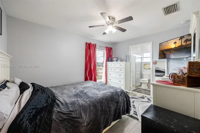 a bed room with a bed and a television