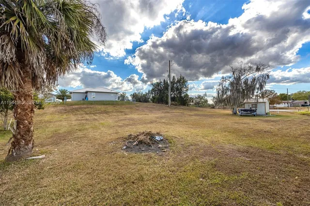 a view of a street with a building in the background
