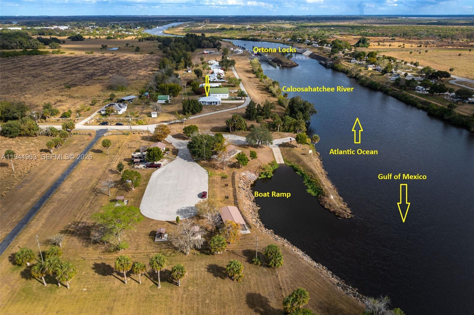 1053 Lock Lane Moore Haven, FL 33471 - Photo 26 of 26 an aerial view of a house with a yard