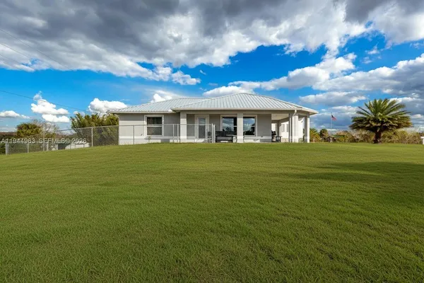 a view of a house with a big yard