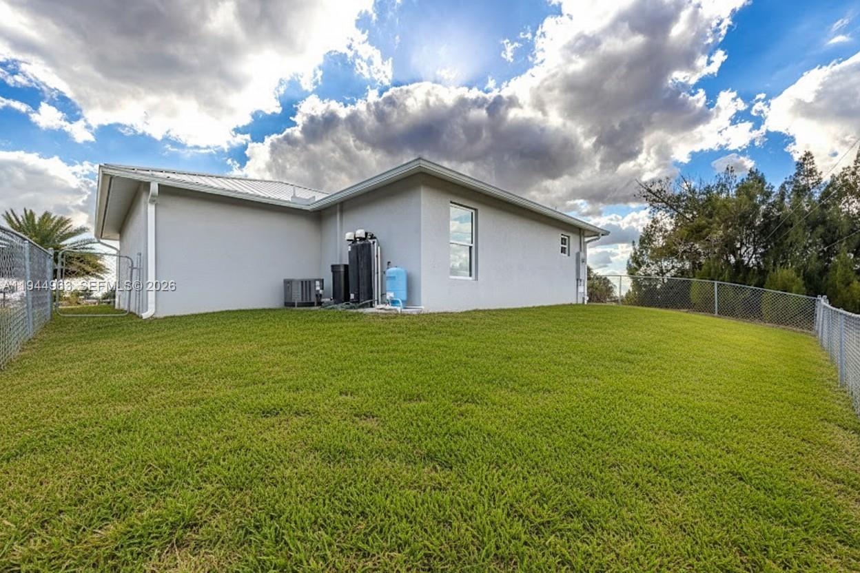 1053 Lock Lane Moore Haven, FL 33471 - Photo 4 of 26 a house view with a garden space