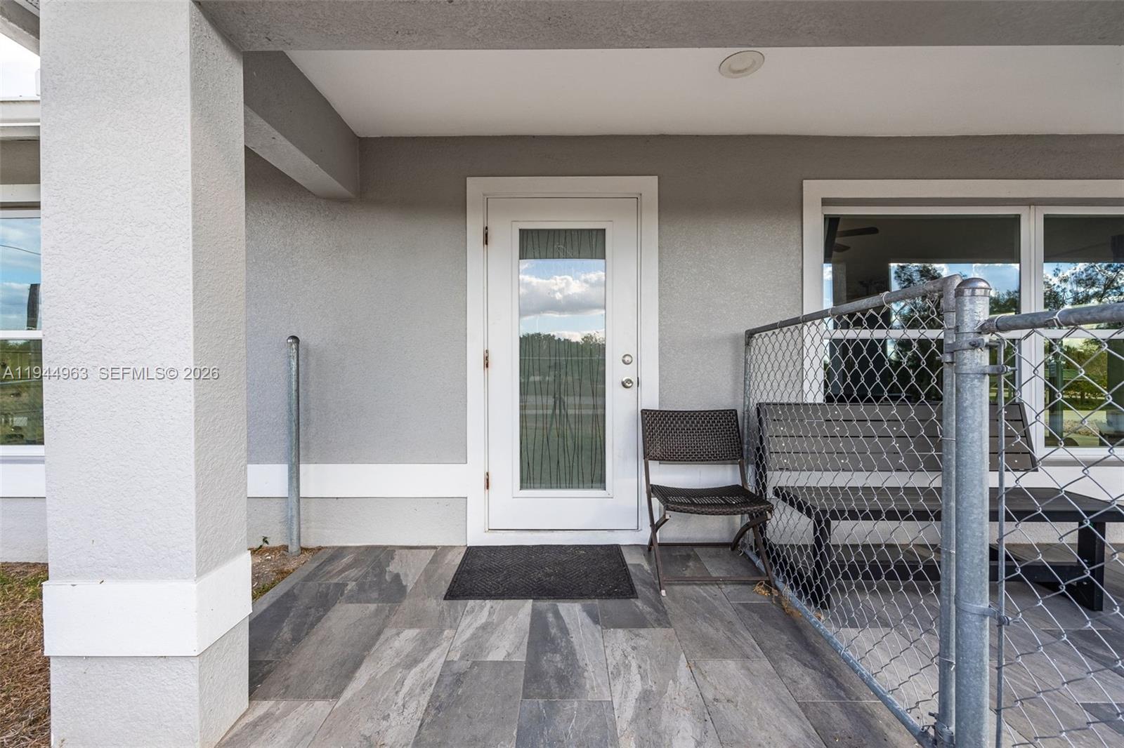 1053 Lock Lane Moore Haven, FL 33471 - Photo 6 of 30 a view of front door deck and furniture