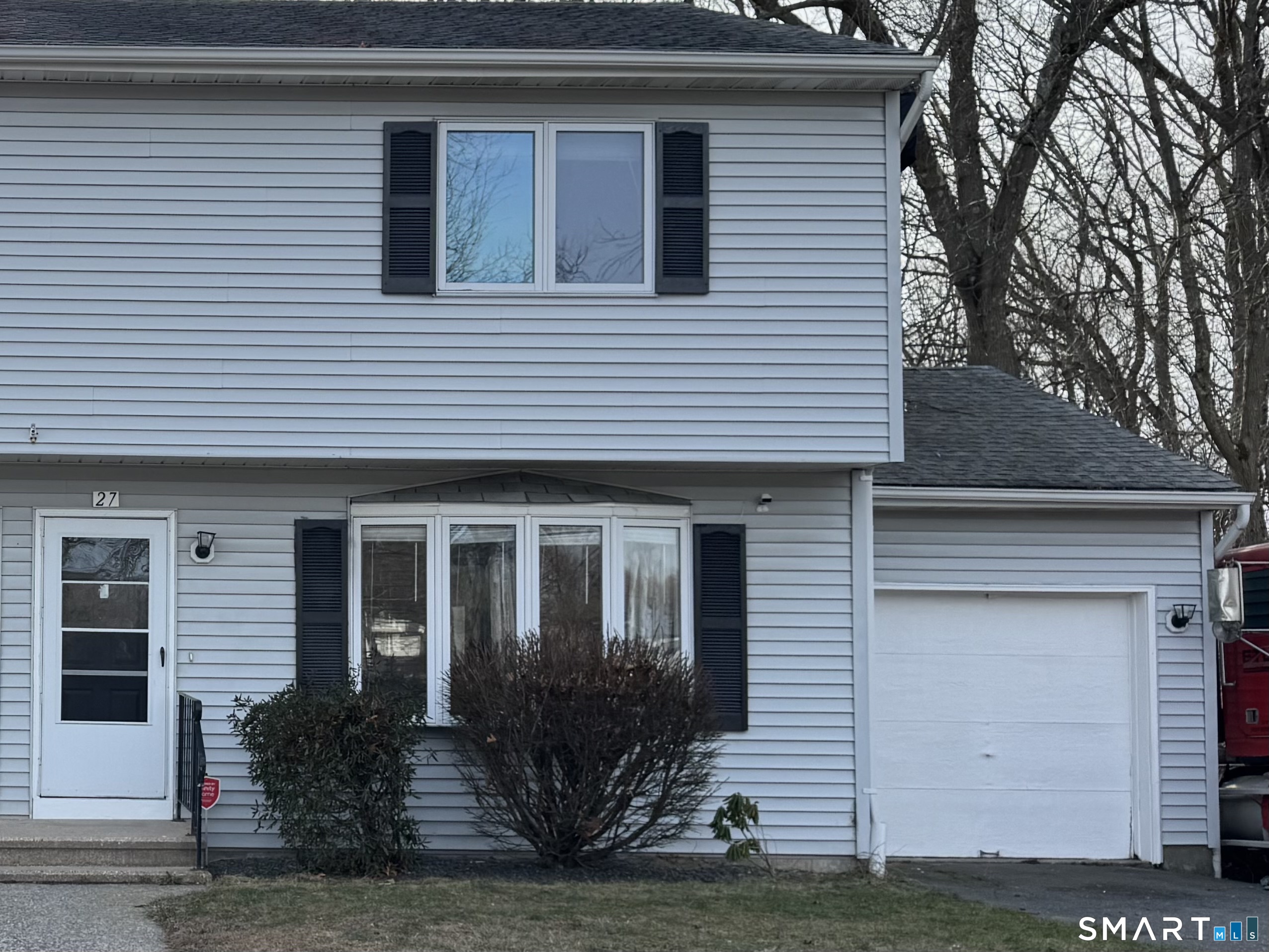 27 Katie Lane Waterbury, CT 06708 - Photo 1 of 14 a front view of a house with garden