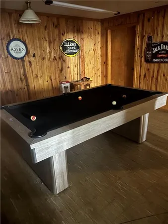 a view of room with window and wooden floor