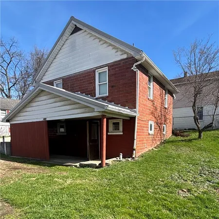 a house view with a garden space