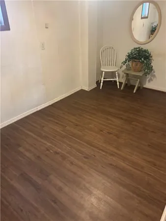 a view of an empty room and wooden floor