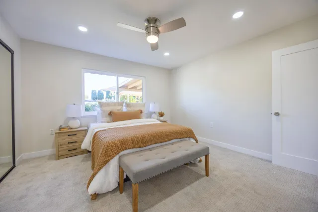 a bedroom with a bed and window