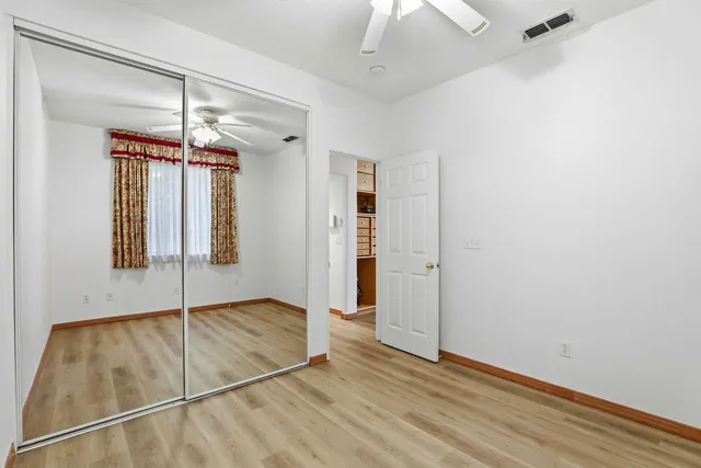 a view of a hallway with closet