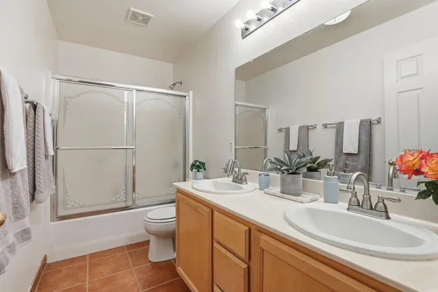 a view of a patio with a table and chairs