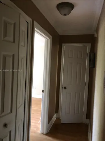 a kitchen with a sink a stove and cabinets