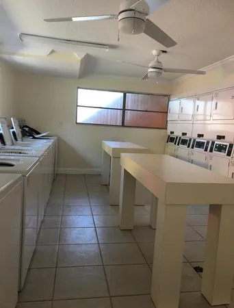 a view of swimming pool with sitting area