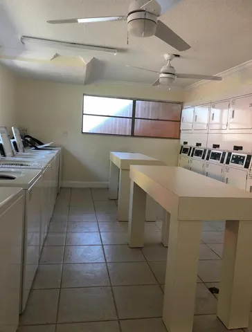 a view of swimming pool with sitting area