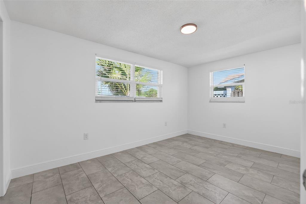 10914 Leeds Road Port Richey, FL 34668 - Photo 15 of 24 an empty room with windows