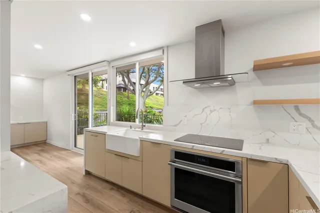 a kitchen with a stove and a sink