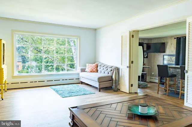 a kitchen with granite countertop a sink stainless steel appliances and cabinets
