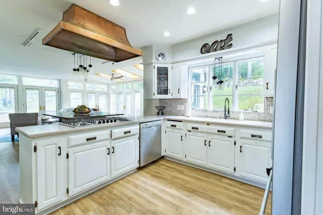 a dining room with furniture and wooden floor